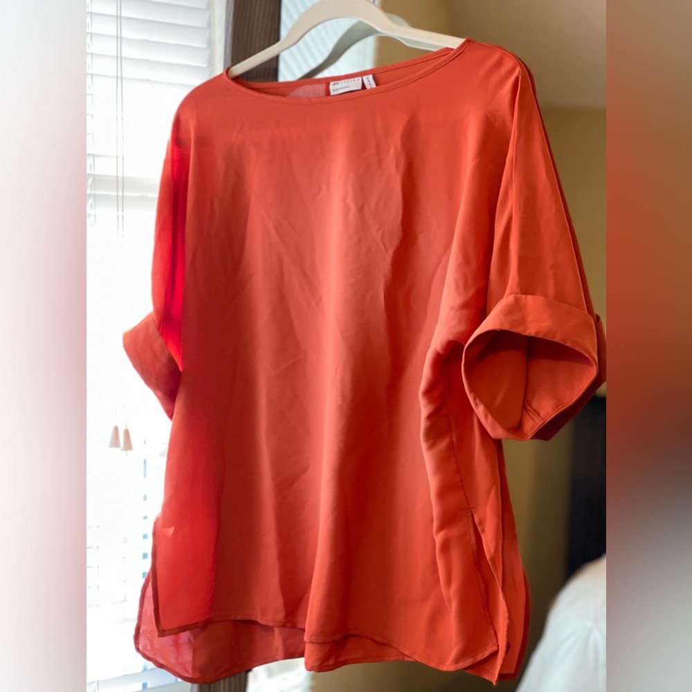 ASOS DESIGN oversized woven tee with roll sleeve in the color rust.